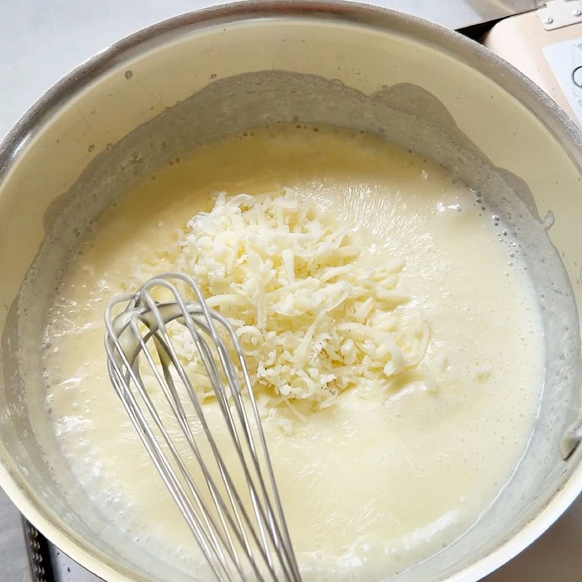 Melting cheese added to base.