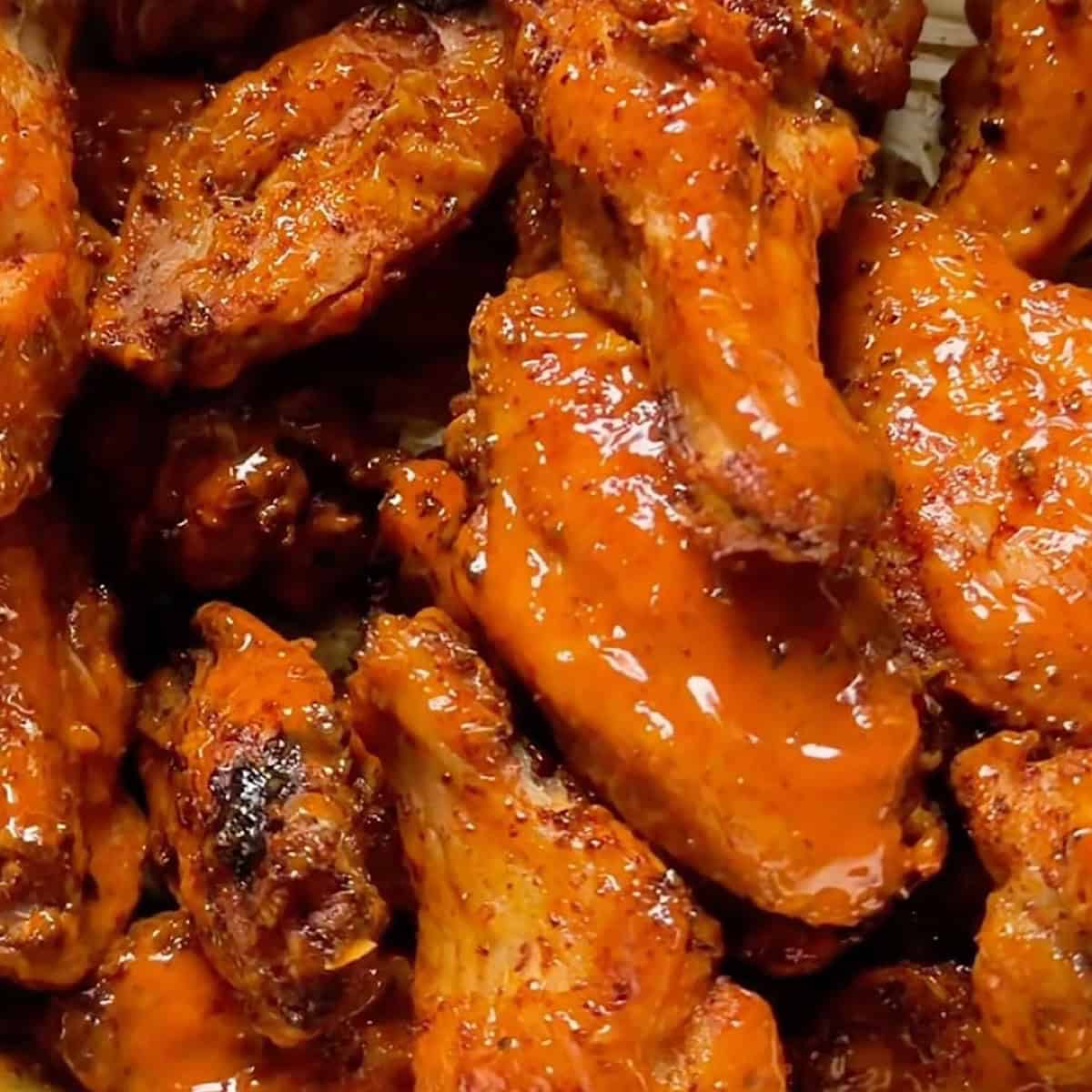 Crispy baked garlic buffalo wings tossed in homemade buffalo sauce.