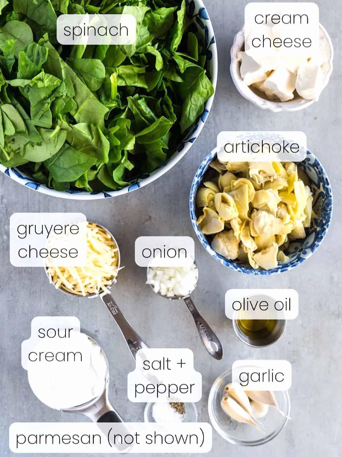 A labeled image of everything needed to make creamy spinach artichoke dip without mayo.