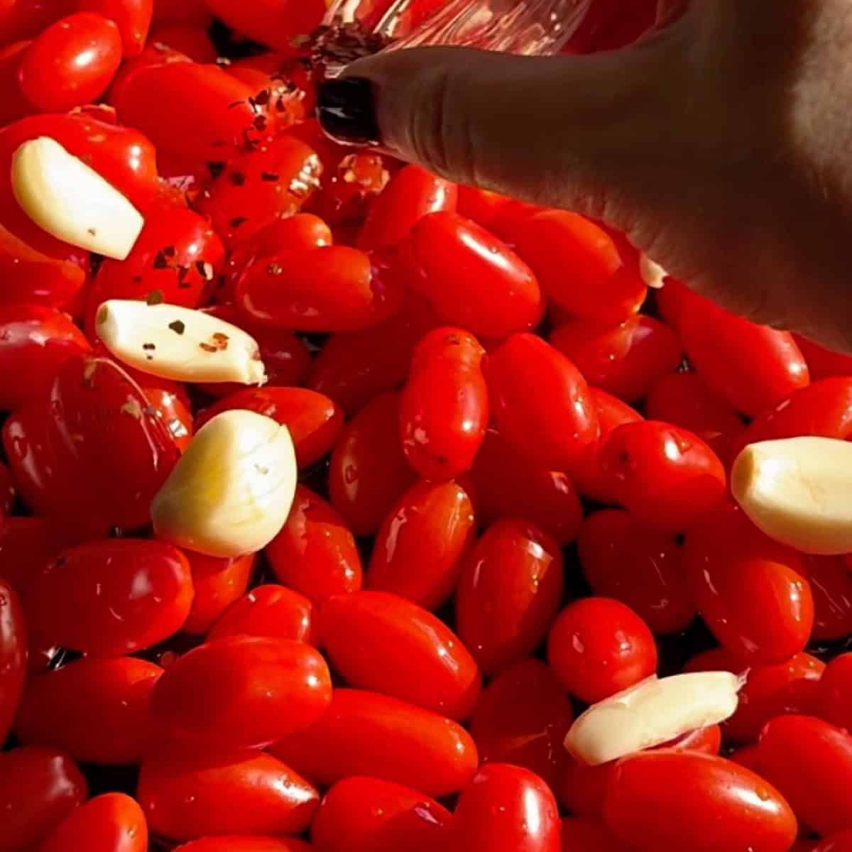 Oil, garlic, and herbs added to the skillet.