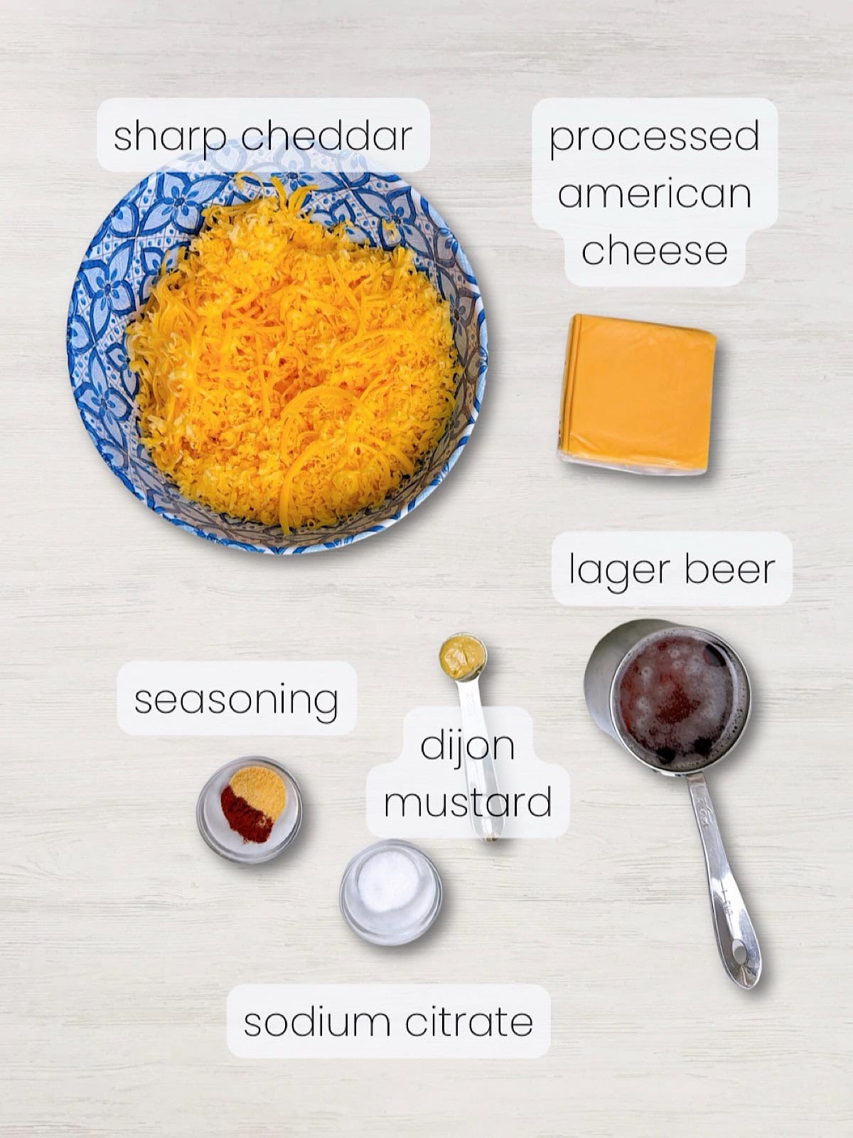 A labeled image of everything needed to make beer cheese dip for pretzels.