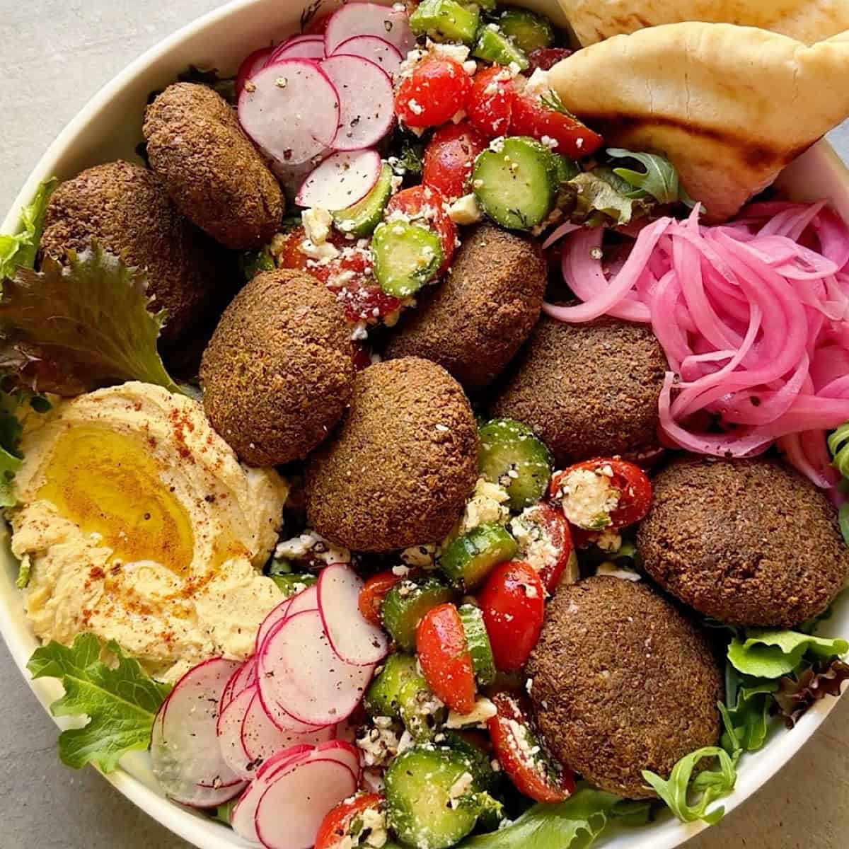 Falafel salad assembled with all the toppings.