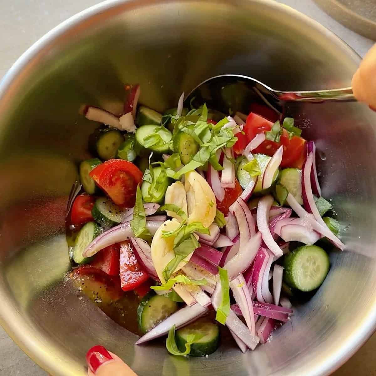 Folding in the fresh basil.
