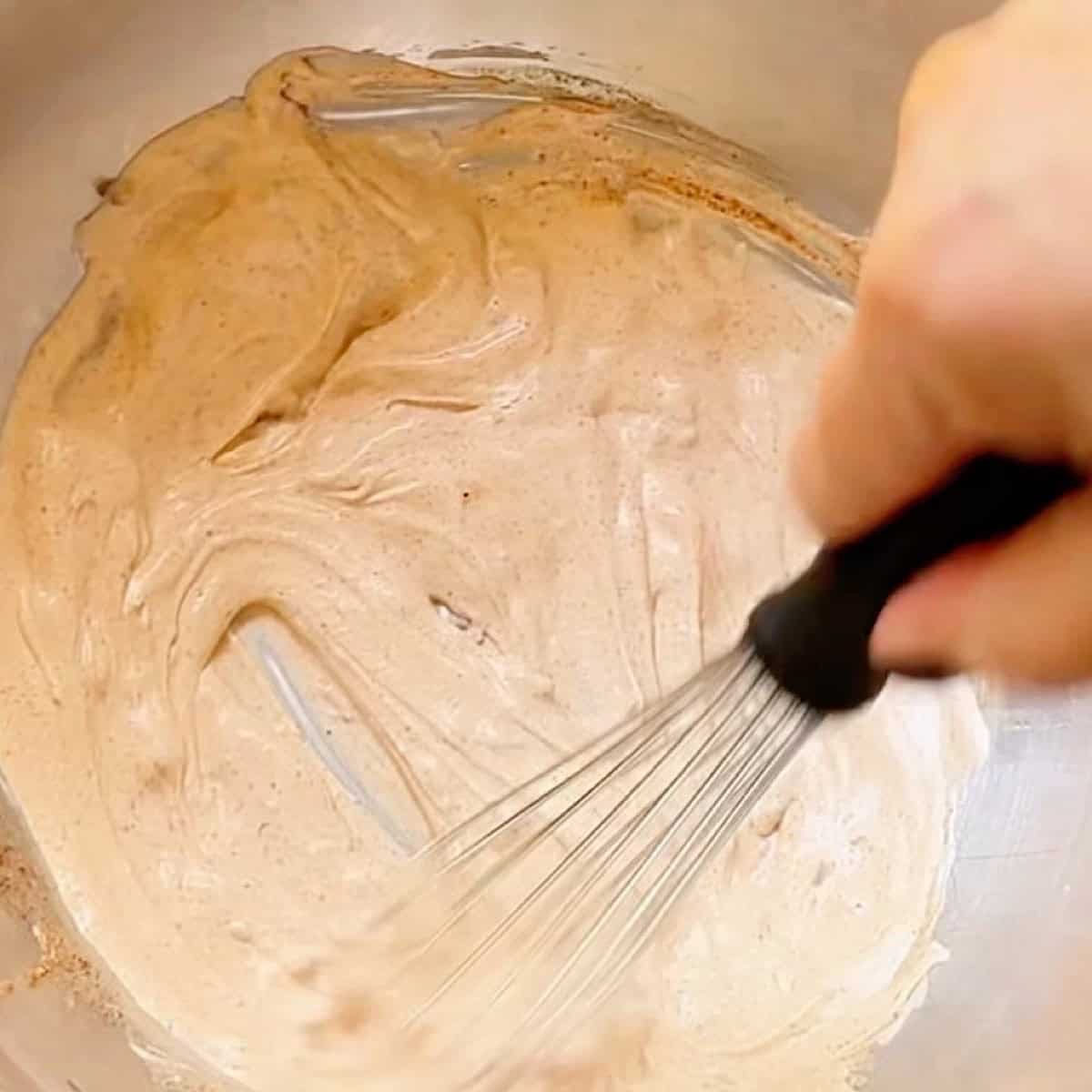 Whisking the chipotle dressing.