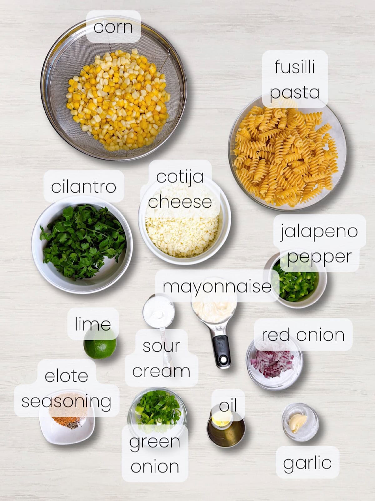 A labeled image of everything needed to make elote pasta salad.