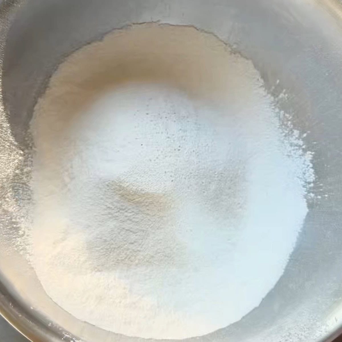Dry ingredients whisked in a mixing bowl.