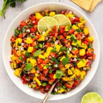 Fresh mango pico de gallo with lime and cilantro, perfect for salsa lovers.