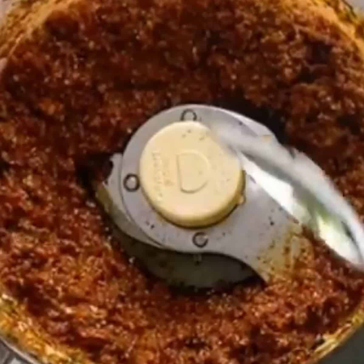 Lid removed to show blended sundried tomato pesto.