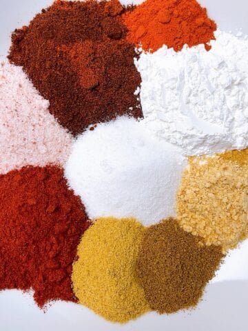 Fajita seasoning spice mix arranged on a plate to show color variation.