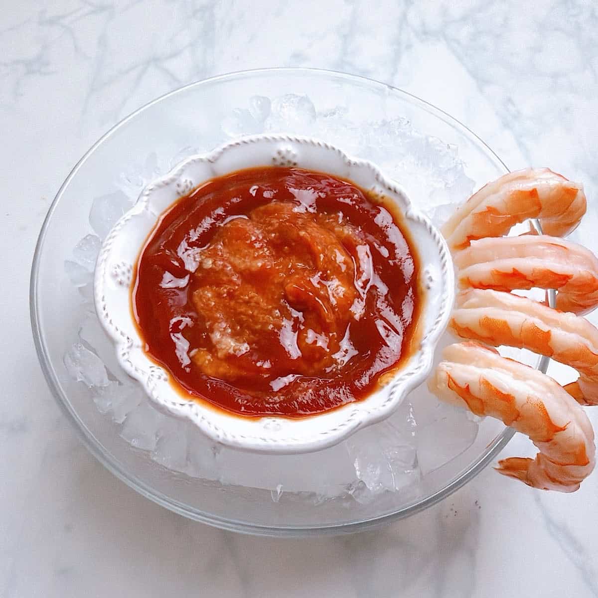 Assembling the cocktail platter in a small bowl.