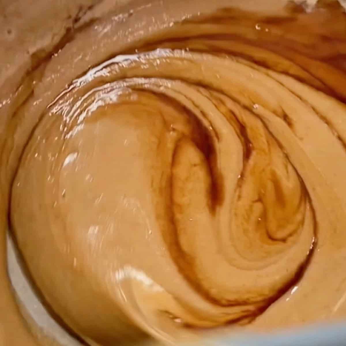 Vanilla being stirred into the peanut butter mixture.