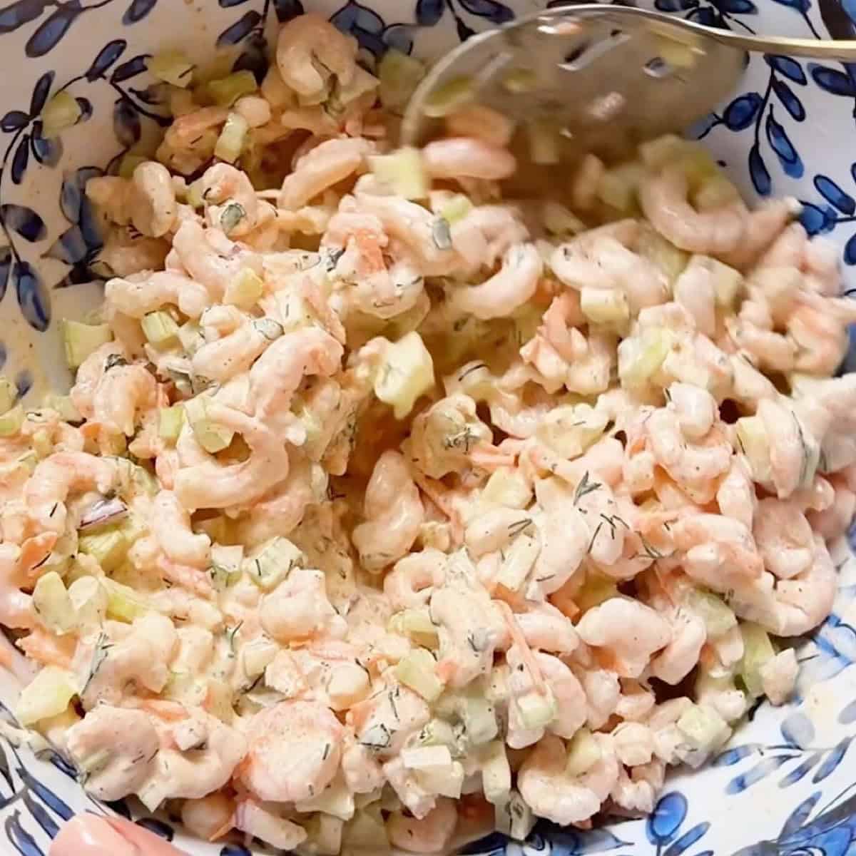 Salad shrimp and veggies mixed in with the dressing.