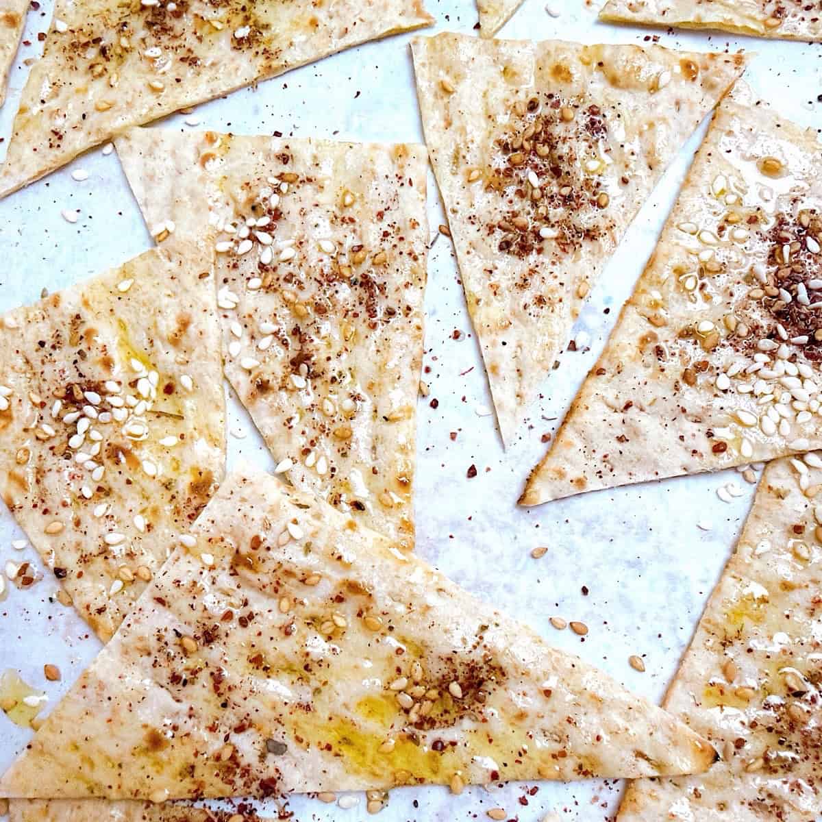 Lavash bread seasoned with oil, za'atar, and sesame seeds.