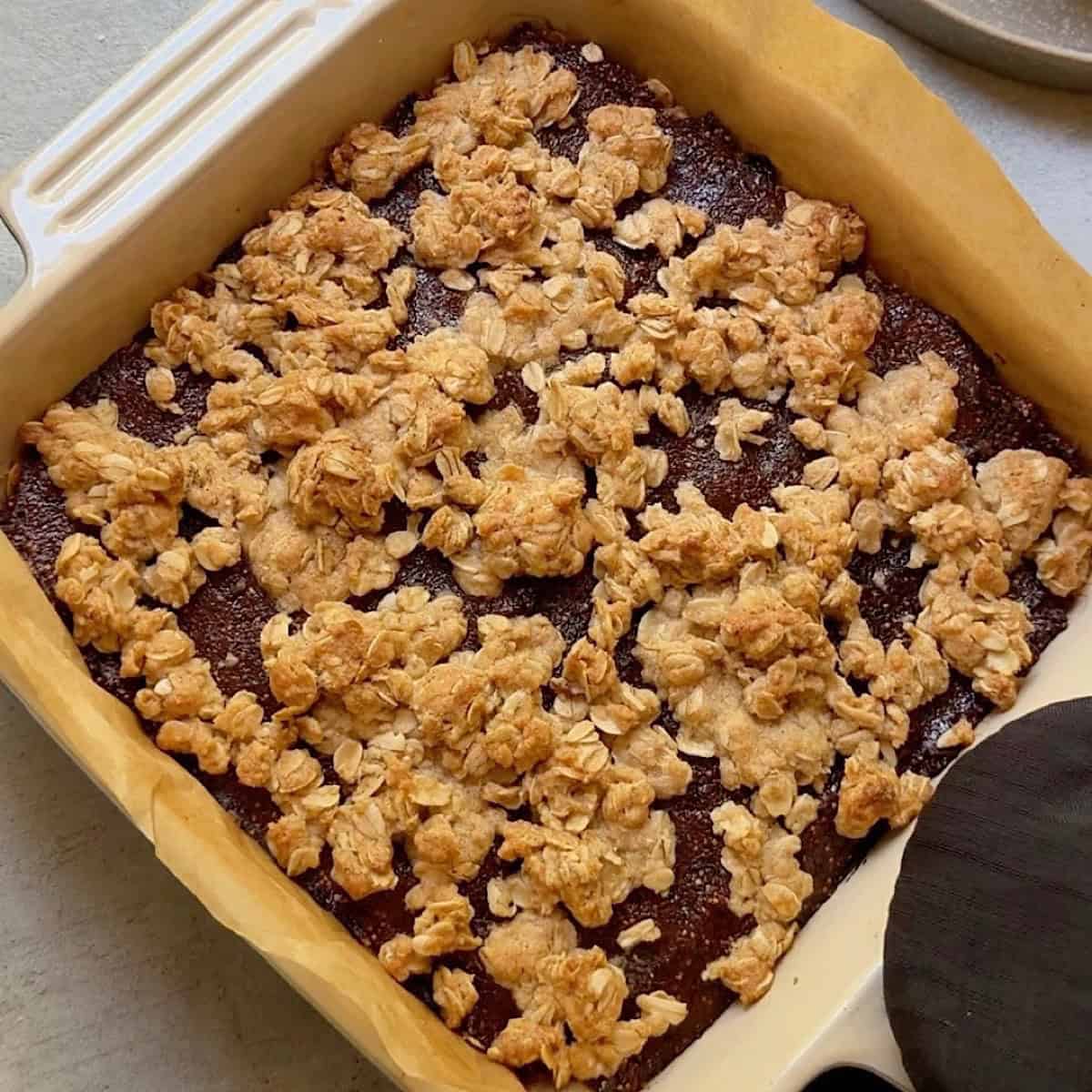 Baked fig oatmeal bars cooling in an 8x8 dish.