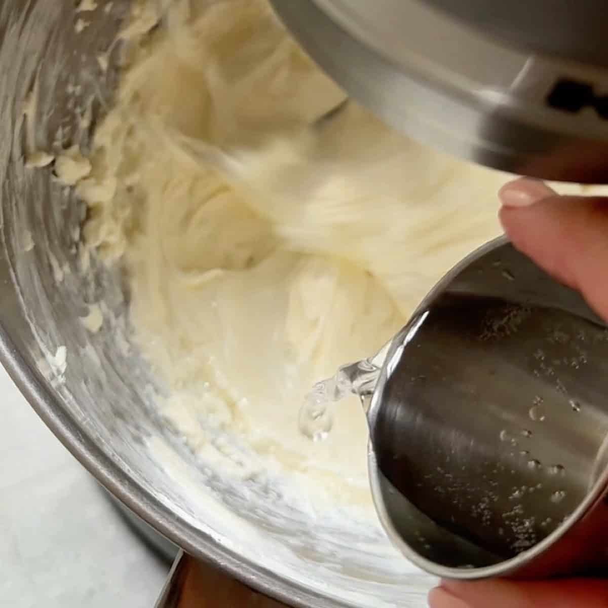 Adding seltzer water to the cream cheese while whipping.