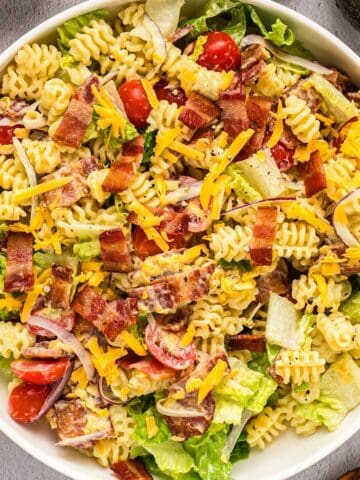 BLT pasta salad tossed in a wide serving bowl.