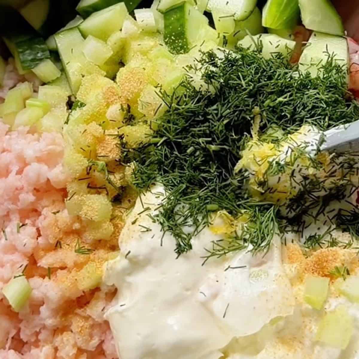 Chopped shrimp and remaining salad ingredients added to a mixing bowl.