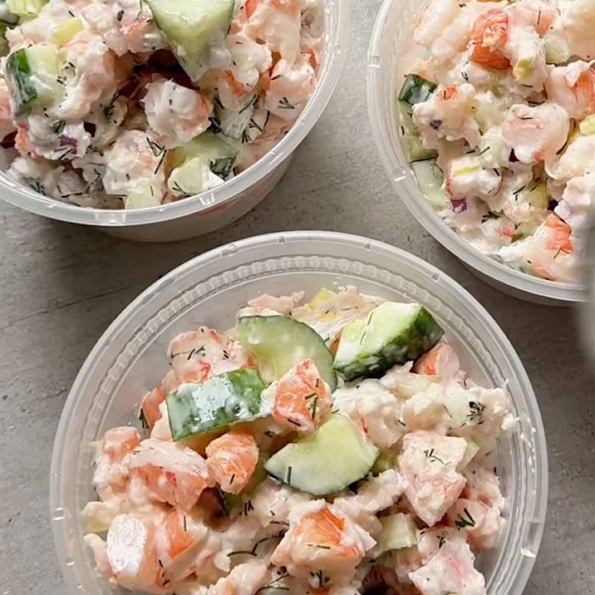 Shrimp salad in meal prep containers ready to chill in the refrigerator.