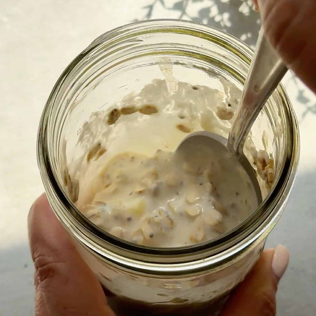 Mixing the oats mixture with a spoon to show texture.