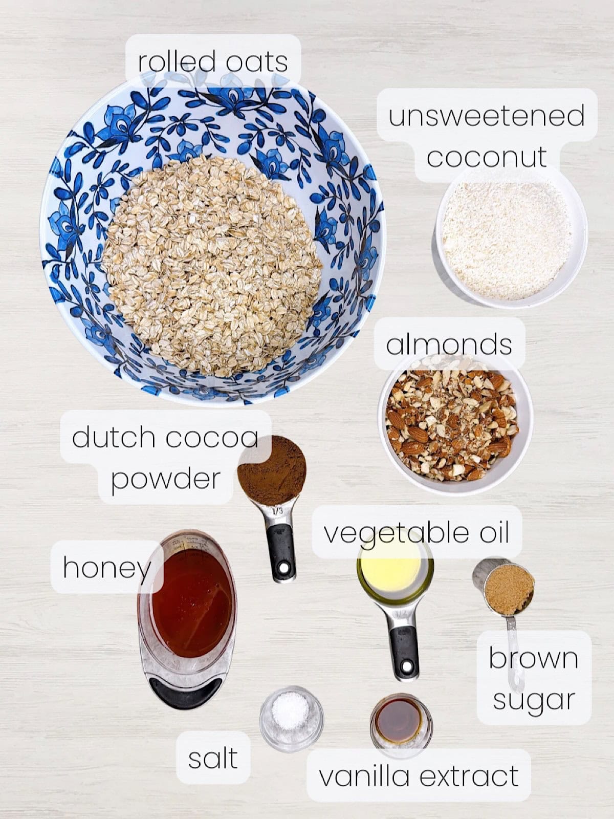 A labeled image of everything needed to make dark chocolate granola with coconut.