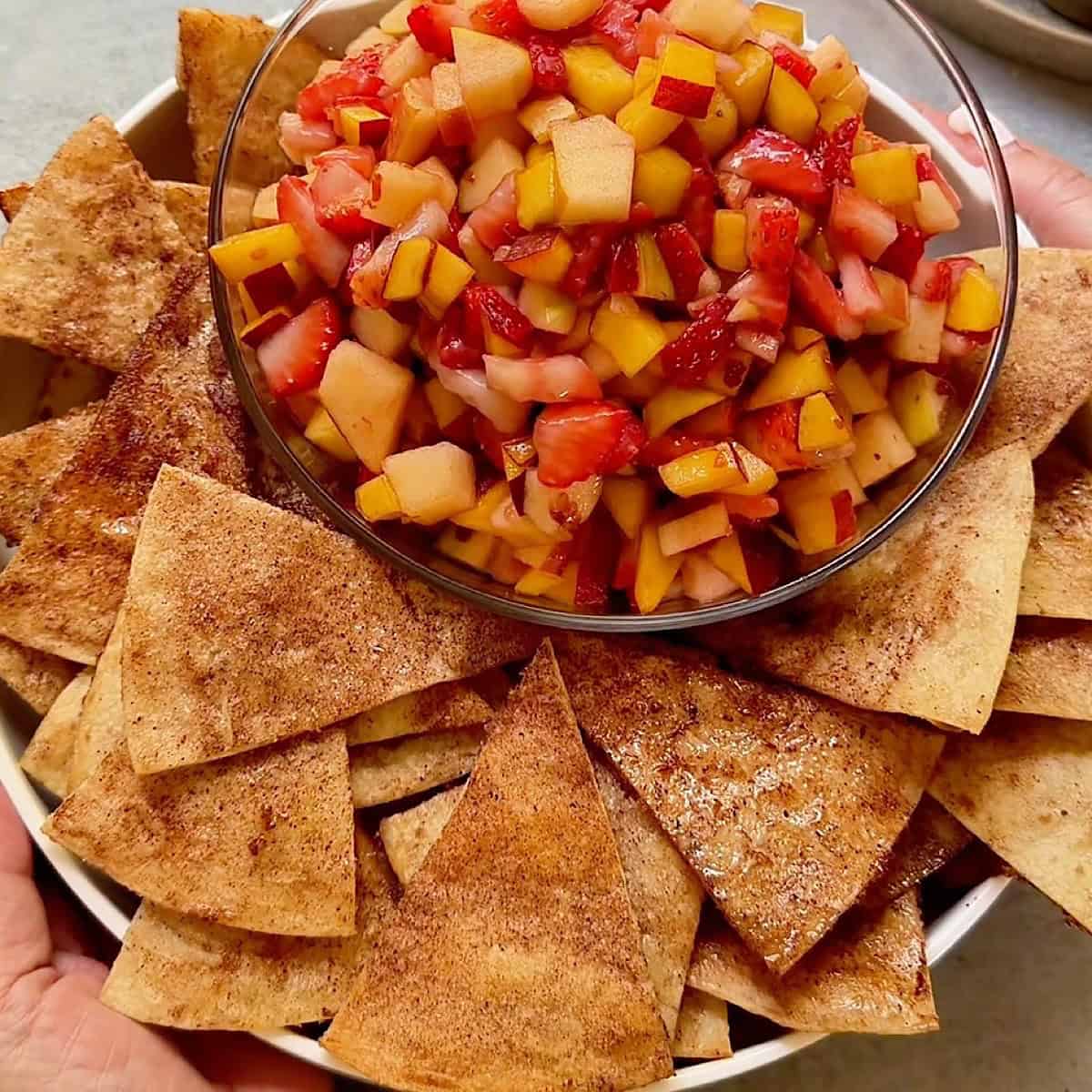 Fruit salsa with cinnamon chips in a platter ready to serve.