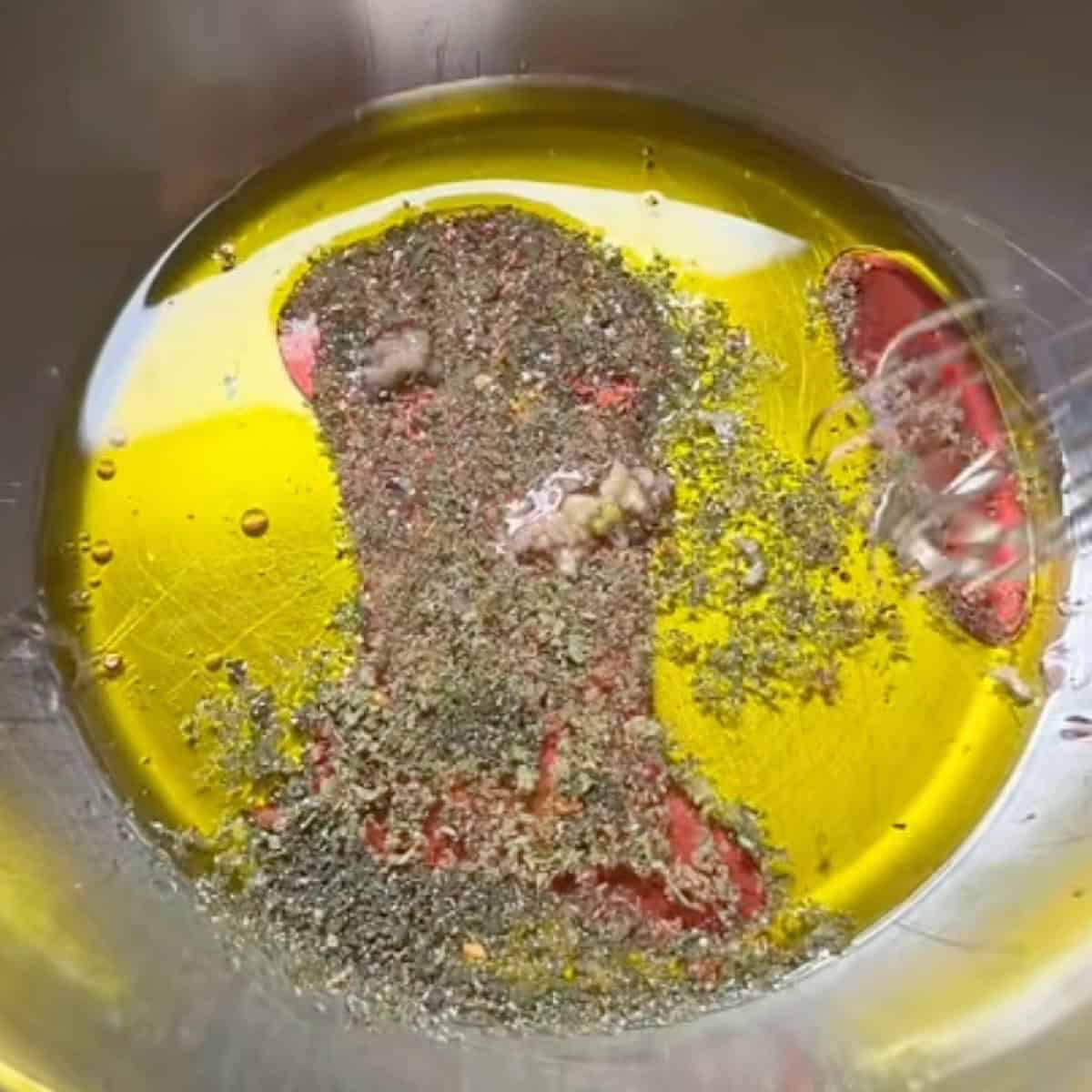 Vinaigrette dressing in a bowl ready to whisk.