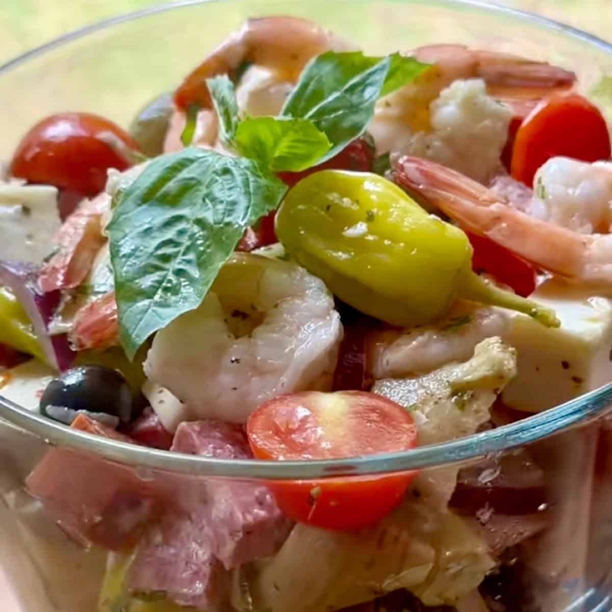 Chilled antipasto salad in serving dish ready to serve.