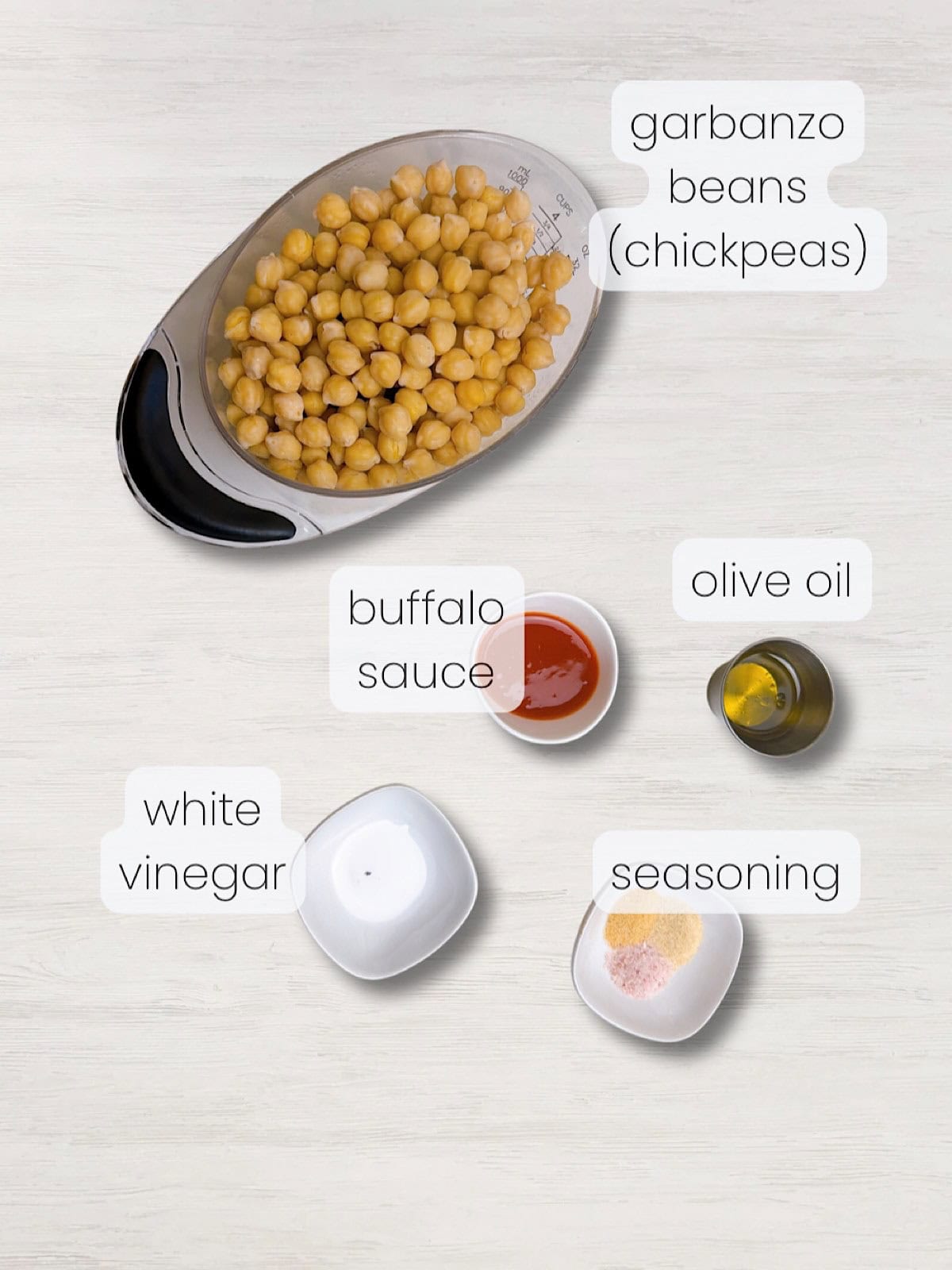A labeled image of everything needed to make crispy buffalo chickpeas.