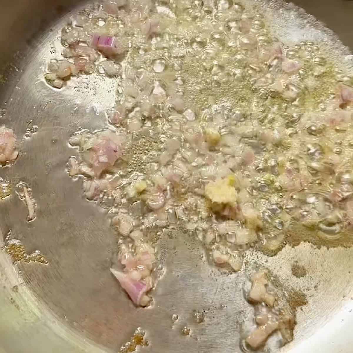 Shallot and garlic sauteeing in olive oil and butter.