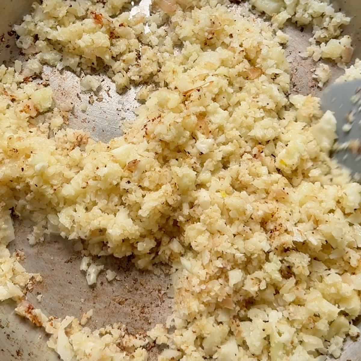 Cauliflower rice beginning to brown.