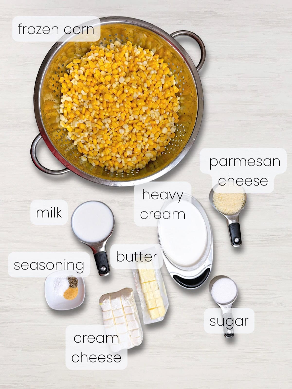 A labeled image of everything needed to make slow cooker creamed corn.