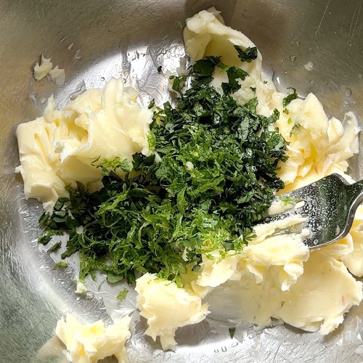 Finely chopped cilantro added to the bowl.