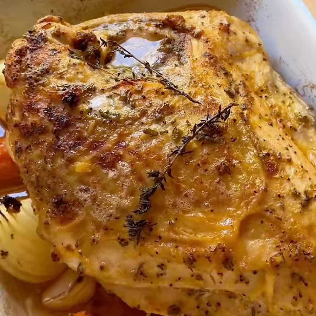 Roasted herb turkey breast fresh from the oven with juices.