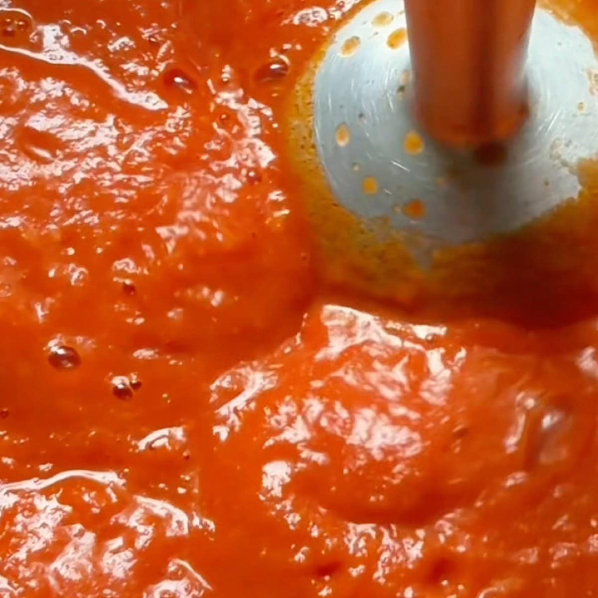 Blending the San Marzano whole tomatoes to make the sauce.